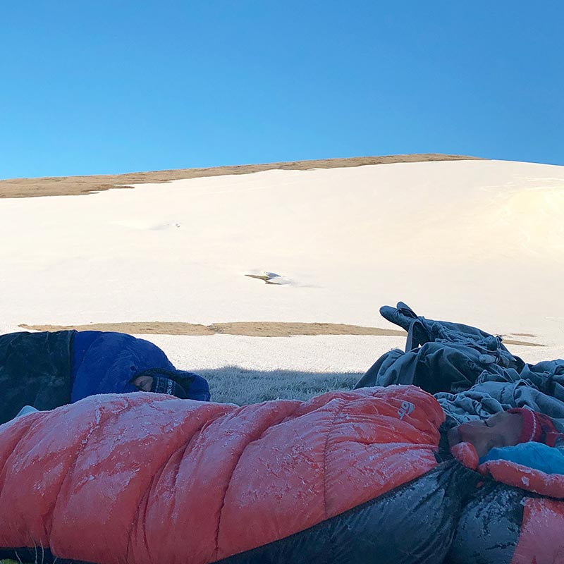 Doug Chatten in a frosty but still warm Mont Helium 600 Down Sleeping Bag on the Main Range NSW Snowy Mountains. By Steve Bickerstaff
